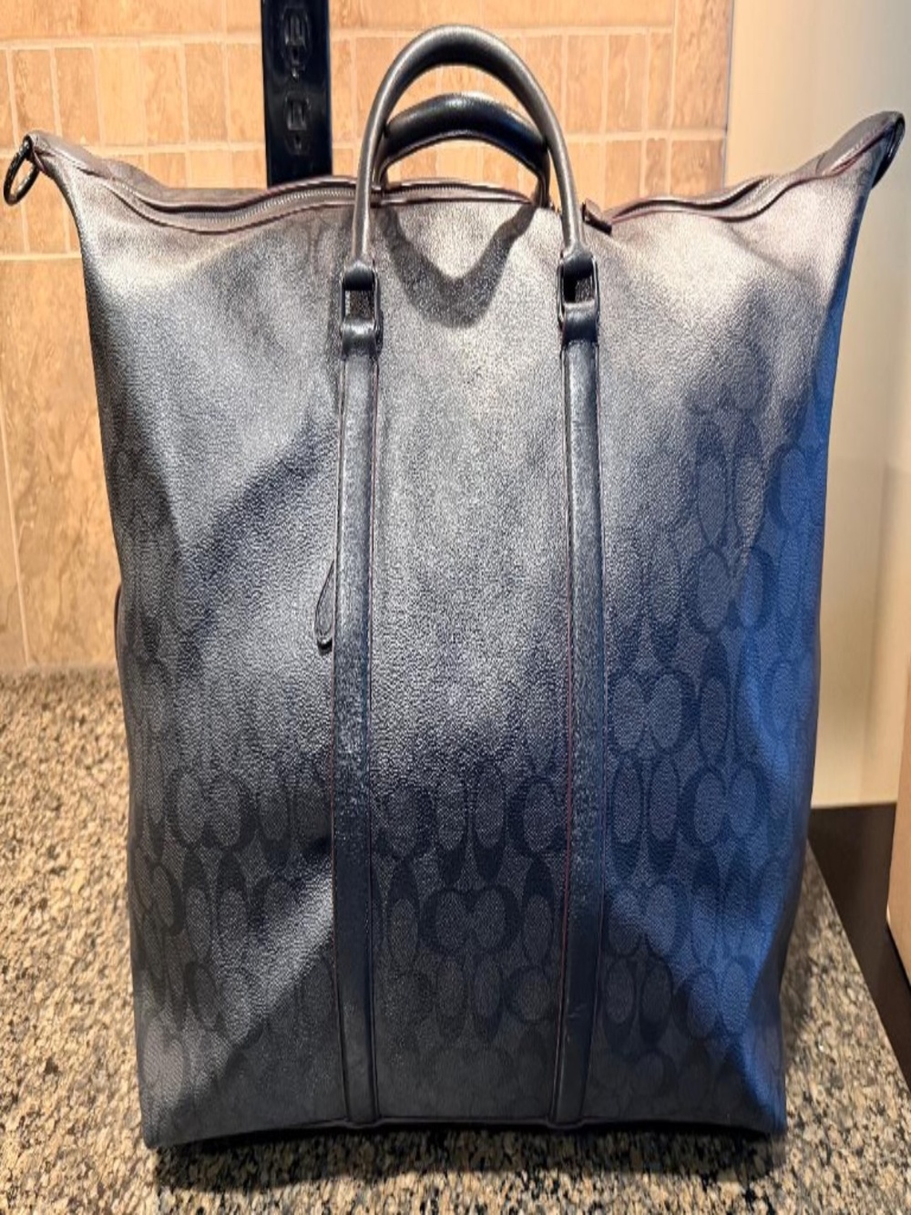 Gently Used - Coach Gotham 45 Duffle Bag is a weekends or business trips.